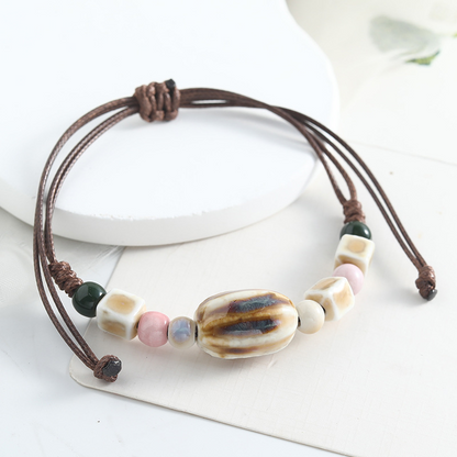🌿 BEGRÄNSAD TID: 50 % RABATT! ✨ Justerbart armband med keramiska pärlor – etniskt, boho, glidande knut 🔮