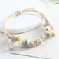 🌿 BEGRÄNSAD TID: 50 % RABATT! ✨ Justerbart armband med keramiska pärlor – etniskt, boho, glidande knut 🔮